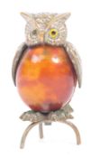 AN EARLY 20TH CENTURY 1930S OWL FIGURINE TAPE MEASURE