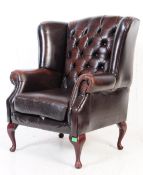 A 20TH CENTURY LEATHER CHESTERFIELD WINGBACK ARMCHAIR