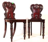 PAIR OF GEORGE III CARVED MAHOGANY HALL CHAIRS