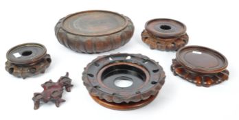 COLLECTION OF SIX CHINESE CARVED SOCCLE STANDS