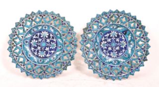 PAIR OF ISLAMIC BLUE PIERCED TIN GLAZED CHARGERS