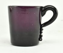 CIRCA 1800 SMALL AMETHYST GLASS MUG WITH SCROLL KICK HANDLE
