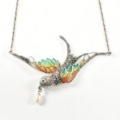 A SILVER & RUBY PLIQUE-A-JOUR BIRD IN FLIGHT NECKLACE