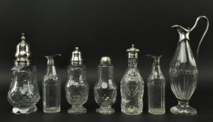 SEVEN 19TH CENTURY SILVER MOUNTED GLASS CRUET BOTTLES