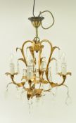 20TH CENTURY GILT METAL FOUR BRANCH TOLEWARE CHANDELIER
