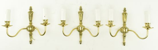 THREE ITALIAN STYLE GILDED METAL TWIN ARM WALL SCONCES