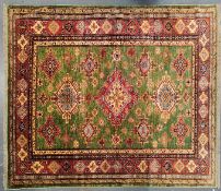 20TH CENTURY RED AND GREEN KAZAK WOOL RUG