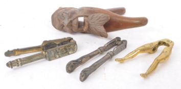 COLLECTION OF FOUR NUTCRACKERS - BRASS AND WOOD EXAMPLES