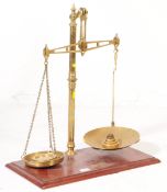 PAIR OF VINTAGE 20TH CENTURY CO-OP WHOLESALE BRASS SCALES