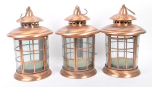SET OF THREE 20TH CENTURY COPPER AND GLASS LANTERNS