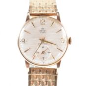 9CT GOLD SMITHS DE LUXE WRISTWATCH ON ROLLED GOLD STRAP
