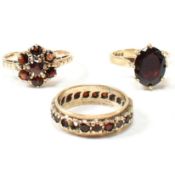 THREE 9CT GOLD & GARNET RINGS