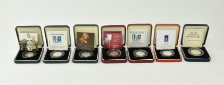 SEVEN ROYAL MINT COMMEMORATIVE FIFTY PENCE COINS