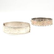 TWO SILVER ENGRAVED HINGED BANGLES