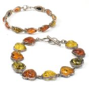 TWO SILVER & AMBER BRACELETS