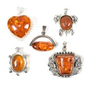 FIVE SILVER & AMBER NECKLACE PENDANTS
