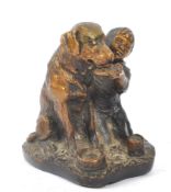 SCHULTZ - A BRONZE FIGURE OF YOUNG BOY FEEDING DOG