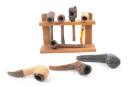 COLLECTION OF VINTAGE 20TH CENTURY SMOKING PIPES WITH STAND
