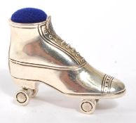 20TH CENTURY STERLING SILVER ROLLER SKATE PIN CUSHION