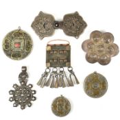 COLLECTION OF WHITE METAL PENDANTS & BUCKLES