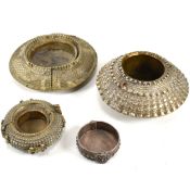 FOUR AFRICAN METAL BANGLES CONVERTED INTO TRINKET DISHES