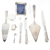 A collection of hallmarked silverware. The items to include hallmarked silver handles cake and