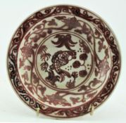 AN UNDERGLAZE COPPER-RED CRACKLED SAUCER 釉里红碟子