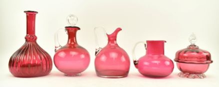 3 VICTORIAN CRANBERRY GLASS EWERS, A DECANTER & LIDDED POT
