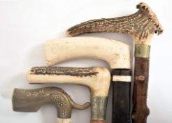 FOUR EARLY - MID CENTURY HORN & BONE HANDLED WALKING STICKS