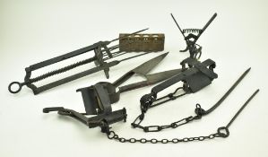 FIVE 19TH CENTURY IRON ANIMAL VERMIN RAPS AND A SHEEP SHEAR