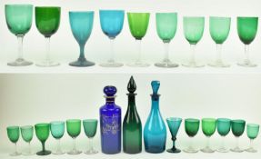 3 COLOURED GLASS DECANTERS & 21 GREEN & BLUE WINE GLASSES