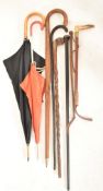 COLLECTION OF VINTAGE WALKING STICKS AND UMBRELLAS