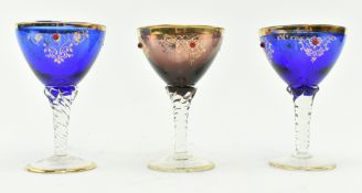 THREE GILT AND COLOURED GLASS BOHEMIAN WINE GLASSES