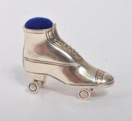 20TH CENTURY STERLING SILVER ROLLER SKATE PIN CUSHION