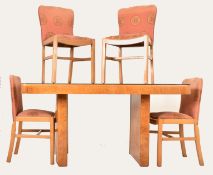 EARLY 20TH CENTURY ART DECO FIGURED WALNUT DINING SUITE