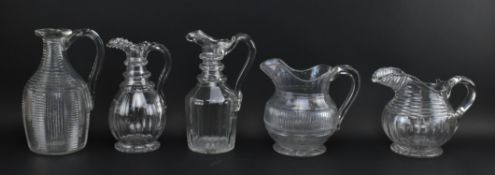 FIVE GEORGE IV CUT GLASS STEP CUT WATER & CLARET JUGS