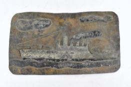 TRENCH ART. MILITARY LEAD PLAQUE DEPICTING A BATTLE SHIP