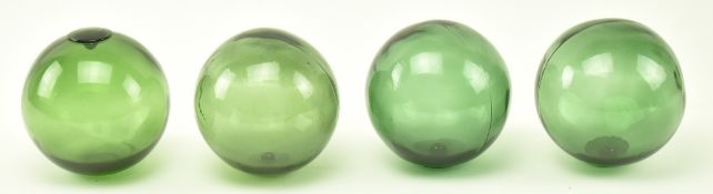 SELECTION OF FOUR VINTAGE GREEN GLASS WITCHES BALLS