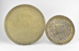 TWO EARLY 20TH CENTURY HAMMERED BRASS CHARGER PLATES