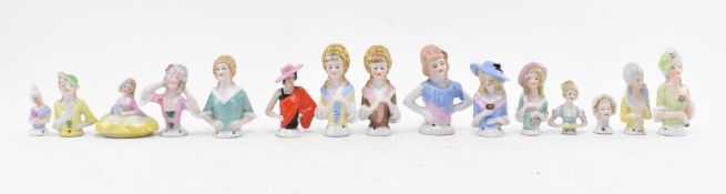 COLLECTION OF FOURTEEN PORCELAIN PIN CUSHION DOLLS HEADS