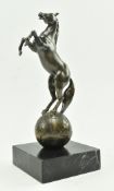 REME BRONZED FIGURINE TROPHY DEPICTING A HORSE ON GLOBE