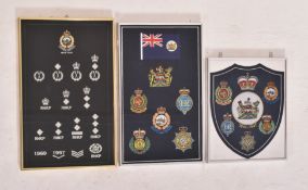 THREE FRAMED MEMEORIAL BADGES OF HONG KONG GOVERNMENT DEPT.