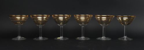 SIX MID CENTURY BOHEMIAN GILT GLASS CHAMPAGNE COUPES