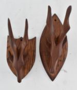 PAIR OF 20TH CENTURY CARVED WOOD TRIBAL ANTELOPE HANGERS