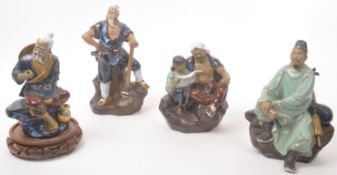 COLLECTION OF FOUR CHINESE MUDMEN FIGURINES