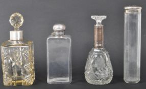 COLLECTION OF FOUR CUT GLASS LADIES VANITY BOTTLES