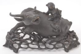 CARVED CHINESE EBONY FIGURE OF WATER BUFFALO ON STAND