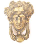 VICTORIAN BRASS DOOR KNOCKER IN THE FORM OF GRECIAN FACE