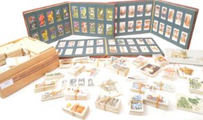 A large collection of 20th century cigarette cards. The collection housed between three Wills