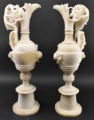 PAIR OF EARLY 20TH CENTURY CREAM ALABASTER EWER JUGS